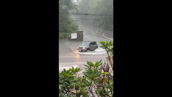 Flooding makes Chickatawbut Rd impassable in Braintree, Massachusetts, USA