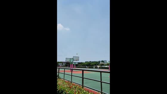Student scores long-range football shot through basketball hoop in Shanghai, China