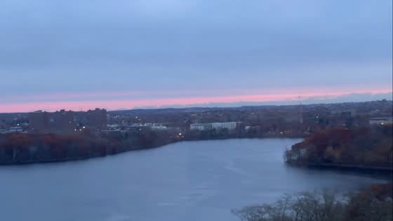 Peaceful sunrise reflected over a calm lake in Cambridge, USA