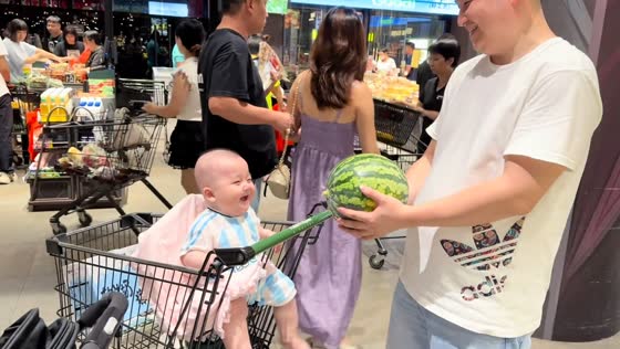 Toddler laughs as man tosses watermelon in Guangdong, China