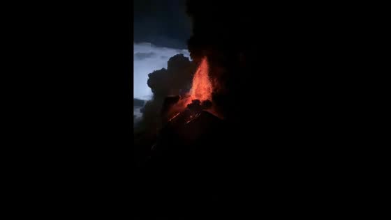 Volcán de Fuego erupts with towering lava fountains over Antigua, Guatemala