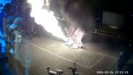 Motor scooter catches fire and explodes outside store in Shanxi, China