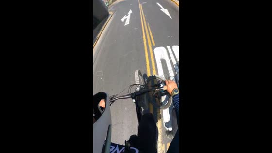 Bicycle collision: hand greeting mishap in Lima, Peru
