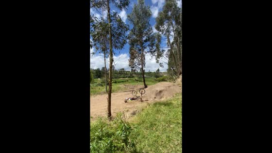 Person falls off bicycle after failed jump in Riobamba, Ecuador