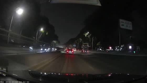 Freight truck suddenly changes lanes and collides with a car on a highway in Guangdong, China