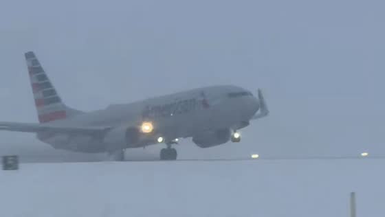 Snowy takeoff and wintry commute at Rochester airport in New York, USA