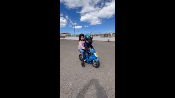 Cool and cute little bikers ride a mini-motorbike in Sardegna, Italy