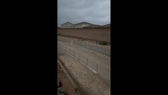 Flash flooding fills drainage channel behind homes in North Las Vegas, USA