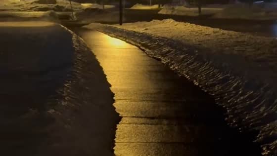 Black ice covers streets and sidewalks in Chili, New York, USA
