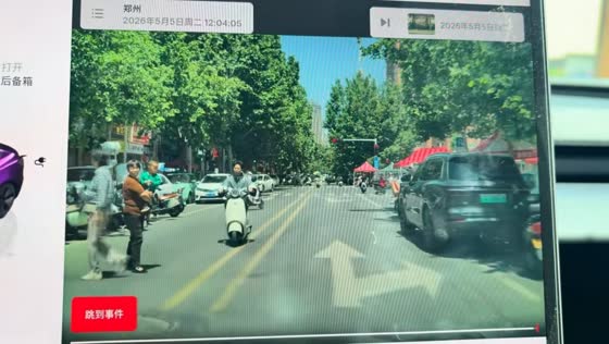 Woman carrying toddler bumps into scooter rider while crossing road in Shandong, China