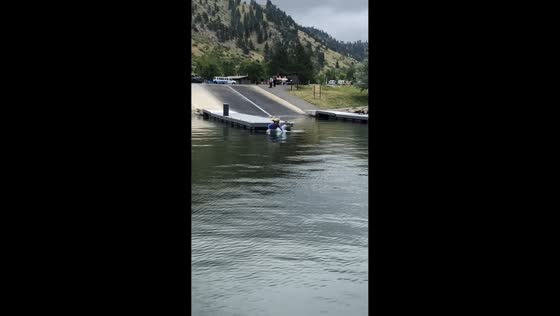 Teen loses balance while tossing boy into lake and falls in with him at Holter Lake, USA
