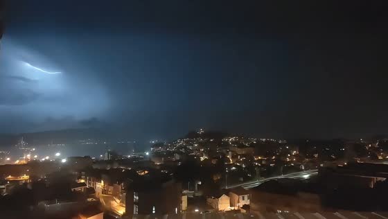 Intense thunderstorm lights up the night sky in Travesía de Vigo, Spain