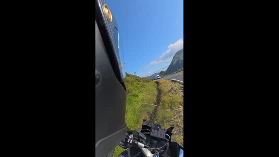 Motorcyclist loses balance and falls on curve in North Wales, UK
