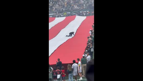 Man gets stuck on giant flag at MetLife Stadium in New Jersey, USA
