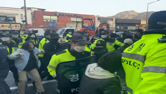 Farmers and police clash during tractor march in Seoul, South Korea