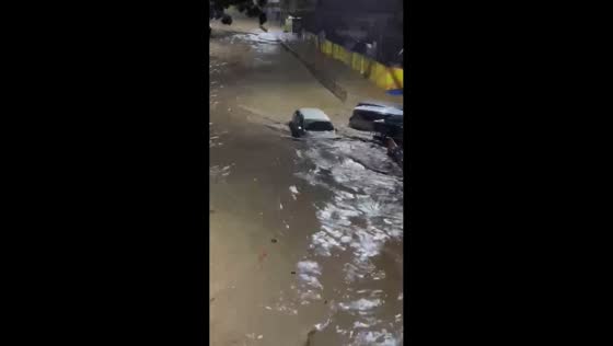 Vehicles swept away during flooding in Iligan, Philippines