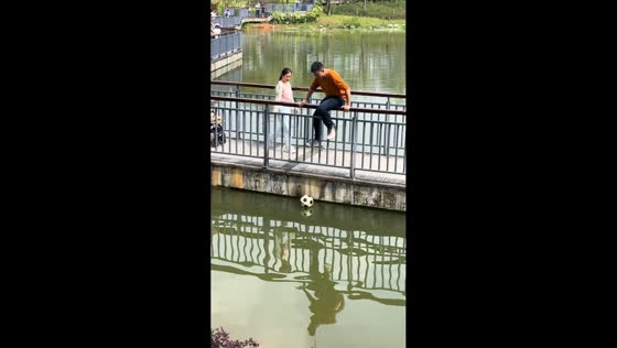 Man retrieves and kicks ball across water in Guangdong, China