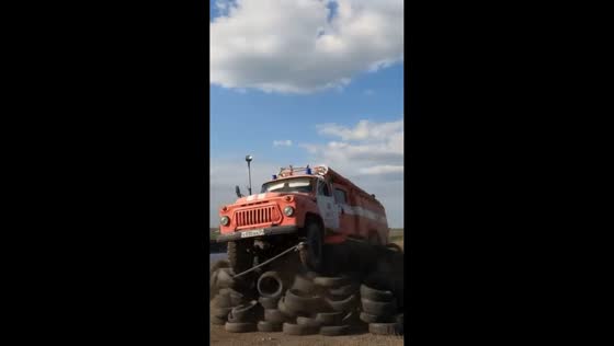 Man performing challenge emerges unharmed after truck drops onto tire pile in Rostov-on-Don, Russia