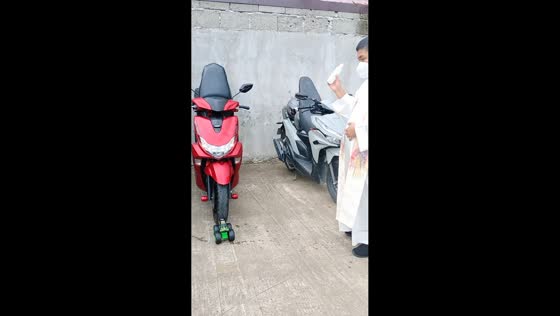 Priest blesses motorcycles and toy car in Sto. Tomas, Philippines