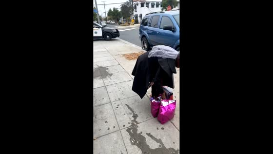 Unexpected police approach during street encounter in Long Beach, California, USA