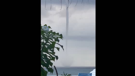Large waterspout swirls off Paradise Island Beach Club in Nassau, Bahamas