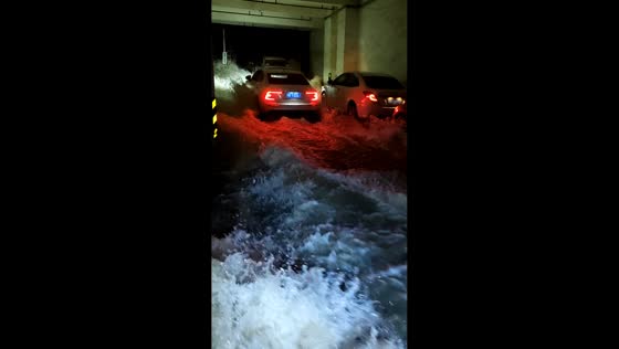 Floodwaters rush into parking garage in Guangxi, China