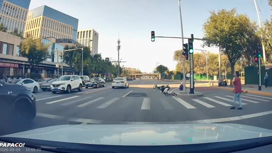 E-scooter and bicycle riders collide at intersection in Beijing, China