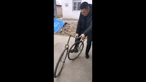 Man attempts to ride a detachable split bicycle in Jiangsu, China