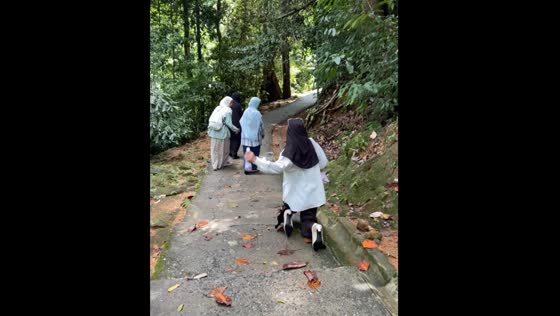 Lady falls while posing for the camera in Langkawi, Malaysia
