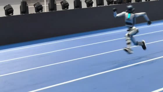 Humanoid robot sprints during track testing in Beijing, China