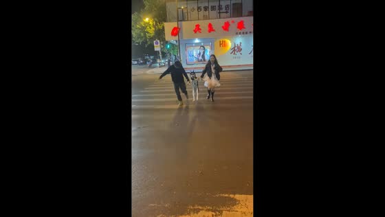 Husky excitedly hops on two legs while crossing the road in Henan, China