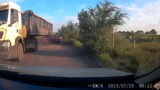 Friend's car narrowly avoids major collision with large truck on rural road