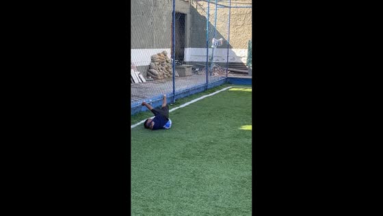 Boy trips over ball in football mishap in Duque de Caxias, Brazil