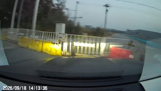 Cars collide at intersection and crash into roadside barrier in Beijing, China