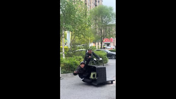 Man falls from plastic crate during playful street ride in Jilin, China