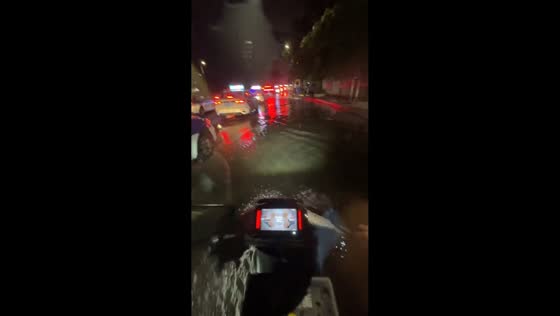 Motorcyclist slips into floodwater during ride in Guizhou, China