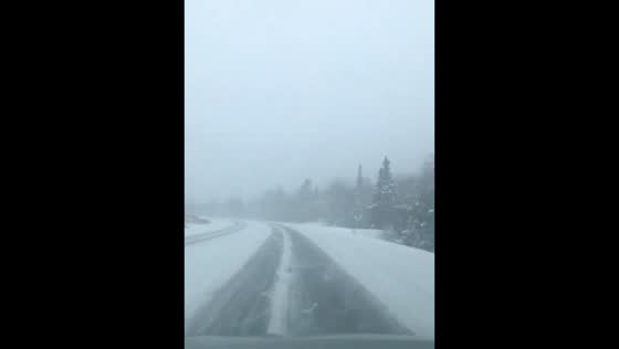 Snow-covered road conditions in Randolph, New Hampshire, USA