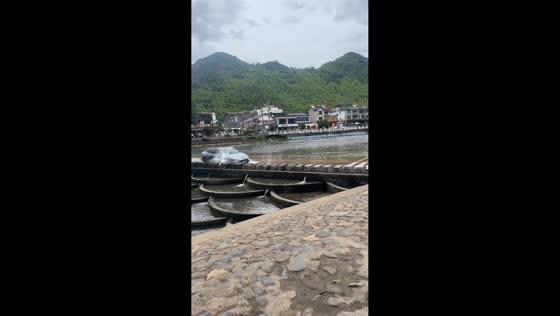 MG7 hits concrete after driving through shallow river crossing in Anhui, China