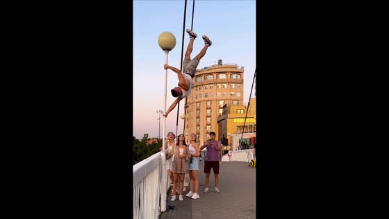 Man performs upside-down calisthenics stunt on street n Krasnodar, Russia