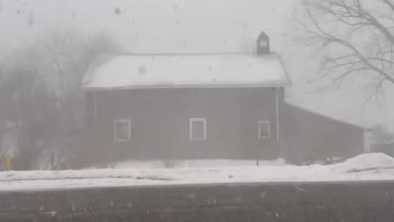Snow squall reduces visibility during storm in Churchville, New York, USA