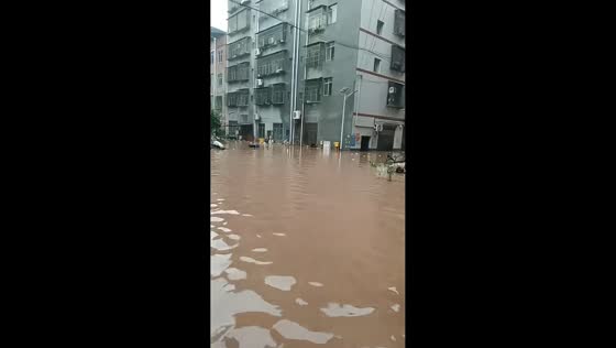 Torrential floodwaters engulf streets and residential buildings in northern Chongqing, China