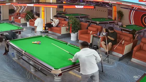 Cue ball jumps to another table and hits phone in Anhui, China