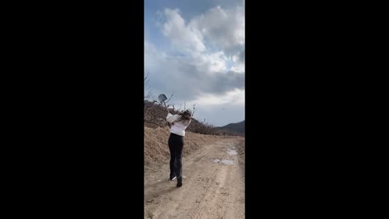 Woman hits golf ball with shovel in Liaoning, China