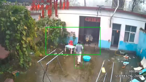 Woman slips and falls on wet backyard while carrying cups in Henan, China