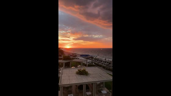 Dramatic sunset contrasts with thunderstorms in Ialysos, Greece