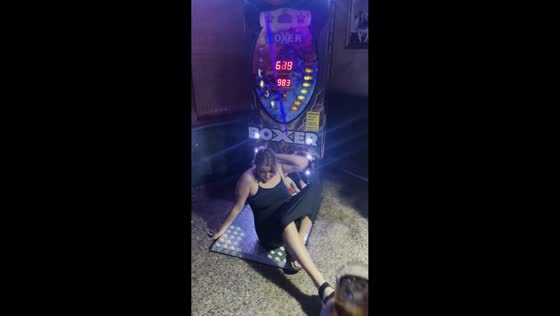 Friend falls after attempting to punch the boxer machine at arcade in Benidorm, Spain