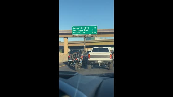Road rage confrontation involving motorcycle and pickup on I-11 in Las Vegas, USA