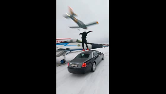 Daring aerial leap: Russian stuntman Chebotarev takes on two planes and a moving car in thrilling stunt