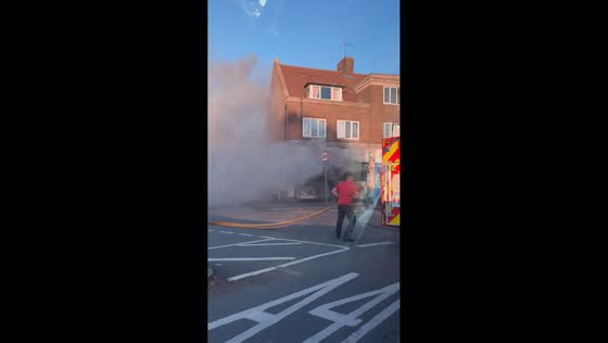 Thick smoke fills street as fire breaks out at dry cleaners in Hounslow, UK