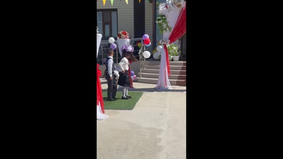 Teacher’s fall startles children during stage entrance in Turkestan, Kazakhstan